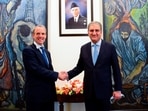 Pakistan's Foreign Minister Shah Mahmood Qureshi (R) welcomes Britain's Foreign Secretary Dominic Raab upon his arrival at the Ministry of Foreign Affairs (MoFA) in Islamabad.
