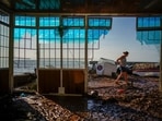 Record rainfall, which prompted an unprecedented flash flood emergency warning for New York City, turned streets into rivers and shut down subway services as water cascaded down platforms onto tracks. In this picture, a resident inspects his restaurant after flooding in the seaside town of Alcanar, in northeastern Spain.(AP)