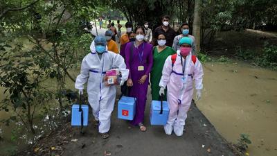 Healthcare workers on way to inoculate villagers during a door-to-door vaccination and testing drive at Uttar Batora Island in Howrah district of West Bengal on June 21. (File photo) Healthcare workers on way to inoculate villagers during a door-to-door vaccination and testing drive at Uttar Batora Island in Howrah district of West Bengal on June 21. (File photo)
