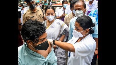 A medic administers a dose of Covid-19 vaccine to a beneficiary in the presence of Kerala health minister Veena George in Thiruvananthapuram. (PTI) A medic administers a dose of Covid-19 vaccine to a beneficiary in the presence of Kerala health minister Veena George in Thiruvananthapuram. (PTI)