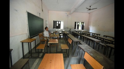A teacher conducting an online class in an empty classroom. (HT Photo)