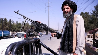 A member of the Taliban force stands guard at a checkpoint in Kabul, Afghanistan. (REUTERS)