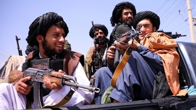 Taliban forces patrol in front of Hamid Karzai International Airport in Kabul, Afghanistan. (REUTERS)