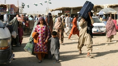 The European Union is eager to stem migration from Afghanistan and has cited the potential security threat. In picture: People from Afghanistan cross into Pakistan. (Reuters)