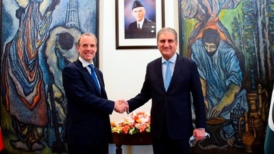 Pakistan's Foreign Minister Shah Mahmood Qureshi (R) welcomes Britain's Foreign Secretary Dominic Raab upon his arrival at the Ministry of Foreign Affairs (MoFA) in Islamabad. (via Reuters)
