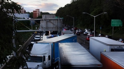 Trucks are seen abandoned on the Major Deegan Expressway. Hundreds of flights were cancelled at LaGuardia and JFK airports, as well as at Newark, where video showed a terminal inundated by rainwater. (REUTERS)