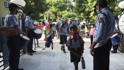 Students in a school in Uttar Pradesh are being welcomed by their seniors with drum rolls. Some schools in the state also decorated the entry gates with balloons (HT Photo/Deepak Gupta)