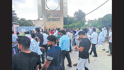 Protestors outside the Shiv Nadar University on Friday (HT photo) Protestors outside the Shiv Nadar University on Friday (HT photo)