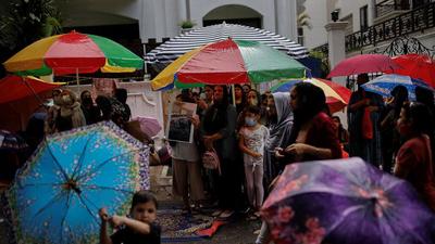 Afghan nationals at a protest outside the United Nations High Commissioner for Refugees in Delhi. (REUTERS)