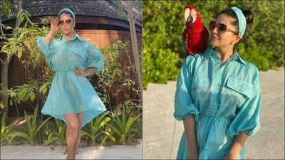 Serving another sizzling mini dress look, Sunny Leone flooded the Internet with her smoking hot pictures in a sheer blue lagoon dress and hairband from Peeké and posed with a macaw perched on her shoulder. The blue mini dress sported tiny white polka dots all over, came with a collar that extended into a buttoned down front and featured two pseudo chest pocks, balloon sleeves that were cinched at the elbow, an asymmetrical hemline and a drawstring that cinched the dress at the waist. (Instagram/sunnyleone) Serving another sizzling mini dress look, Sunny Leone flooded the Internet with her smoking hot pictures in a sheer blue lagoon dress and hairband from Peeké and posed with a macaw perched on her shoulder. The blue mini dress sported tiny white polka dots all over, came with a collar that extended into a buttoned down front and featured two pseudo chest pocks, balloon sleeves that were cinched at the elbow, an asymmetrical hemline and a drawstring that cinched the dress at the waist. (Instagram/sunnyleone)