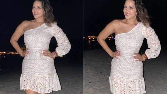 Styled by Hitendra Kapopara and Sameer Katariya, Sunny was seen stepping out for a date night at Maldives beach in a white one-shoulder mini dress from global online fashion brand, How When Wear, that sported cutout work all over to add to the hotness quotient. Leaving her luscious tresses open, Sunny completed the attire with a pair of strappy sandals. (Instagram/sunnyleone)