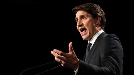Canada's Liberal PM Justin Trudeau speaks to the media after an election debate at TVA studios in Montreal, Quebec. (REUTERS)