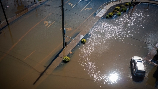 Rainfall from the remnants of Hurricane Ida submerges Mix Street near Farmington Avenue in Bristol, Conn. on Thursday, Sept. 2, 2021. (Mark Mirko/Hartford Courant via AP)