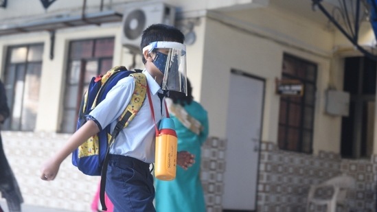 A parent was apprehensive and said that she will immediately stop sending her son to the school if she sees Covid cases rising again.(HT Photo/Deepak Gupta)