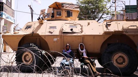 Taliban forces with their armoured vehicles block the road near the presidential place in Kabul, Afghanistan, September 2. (REUTERS)