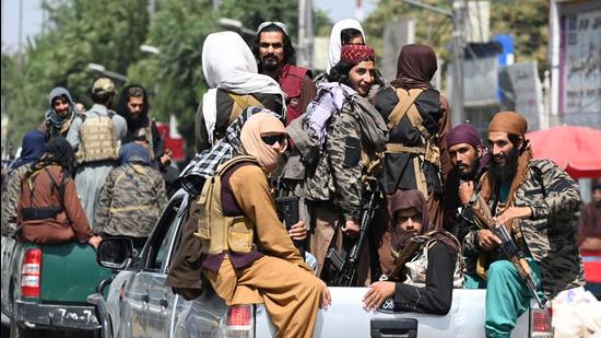 Taliban fighters patrol on vehicles along a street in Kabul on September 2. (AFP) Taliban fighters patrol on vehicles along a street in Kabul on September 2. (AFP)