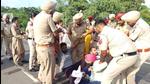 Aspiring teachers holding a protest in Sangrur on Saturday, with police removing them from the roads. (HT Photo) Aspiring teachers holding a protest in Sangrur on Saturday, with police removing them from the roads. (HT Photo)