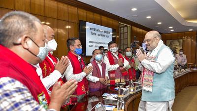 Union home minister Amit Shah greets members from different groups of Assam, after the Karbi Anglong Peace agreement at Home Ministry, North Block in New Delhi, Saturday. (PTI)