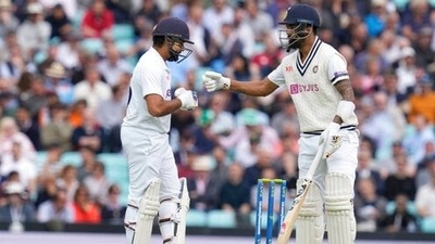 India's Rohit Sharma, left, bumps fists with India's KL Rahul. (AP) India's Rohit Sharma, left, bumps fists with India's KL Rahul. (AP)