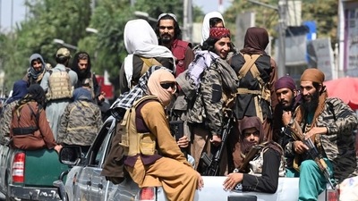 Taliban fighters patrol on vehicles along a street in Kabul. (AFP Photo) Taliban fighters patrol on vehicles along a street in Kabul. (AFP Photo)