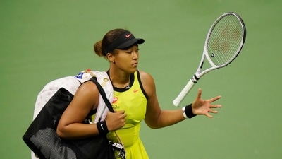 Naomi Osaka, of Japan, tosses her racket to herself after losing to Leylah Fernandez, of Canada, during the third round of the US Open tennis championships, Friday, Sept. 3, 2021, in New York. (AP Photo/Frank Franklin II) (AP)