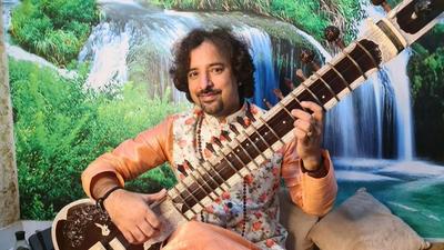 Music teacher Rajkumar has received many laurels for sitar. (Sourced) Music teacher Rajkumar has received many laurels for sitar. (Sourced)