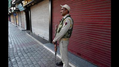 A policeman stands guard in a closed market area of Srinagar on Thursday. (AFP) A policeman stands guard in a closed market area of Srinagar on Thursday. (AFP)