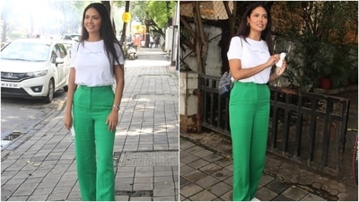 Esha teamed her chic outfit with chunky lace-up sneakers, rings, gold hoop earrings, and stacked bracelets. She also carried a printed chain backpack to complete the day-out look. (HT Photo/Varinder Chawla)