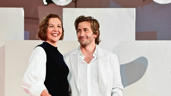 Maggie Gyllenhaal and her brother Jake Gyllenhaal arrive for the screening of the film The Lost Daughter.(AFP)