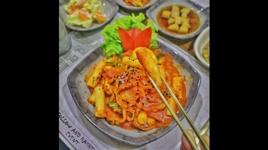 Tteokbokki served at Seoul Restaurant, Delhi. It is a popular Korean rice cake dish