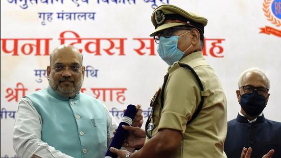 Union home minister Amit Shah felicitates police personnel during the 51st Foundation Day celebration of the Bureau of Police Research and Development, in New Delhi on Saturday. (ANI)