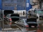 Cars sit in water after flooding on the Major Deegan Expressway spilled over into the neighboring street and flooded a parking lot, when the remnants of Tropical Storm Ida brought drenching rain and the threat of flash floods and tornadoes to parts of the northern mid-Atlantic, in the Bronx borough of New York City. (REUTERS) Cars sit in water after flooding on the Major Deegan Expressway spilled over into the neighboring street and flooded a parking lot, when the remnants of Tropical Storm Ida brought drenching rain and the threat of flash floods and tornadoes to parts of the northern mid-Atlantic, in the Bronx borough of New York City. (REUTERS)