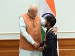 PM Narendra Modi called Para-badminton player Krishna Nagar and congratulated him on winning the prestigious Gold medal.(ANI) PM Narendra Modi called Para-badminton player Krishna Nagar and congratulated him on winning the prestigious Gold medal.(ANI)