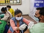 A health worker administers a Covid-19 vaccine shot to a man at a inoculation centre on DDU Marg in Delhi (Sanchit Khanna/ Hindustan Time) A health worker administers a Covid-19 vaccine shot to a man at a inoculation centre on DDU Marg in Delhi (Sanchit Khanna/ Hindustan Time)