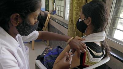 A health worker gives a covid-19 vaccine jab to a beneficiary at a vaccination center at Sahakar Nagar in Pune. (HT PHOTO) A health worker gives a covid-19 vaccine jab to a beneficiary at a vaccination center at Sahakar Nagar in Pune. (HT PHOTO)