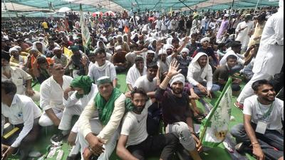 Farmers protesting against the farm reforms, in Muzaffarnagar on Sunday. (PTI)