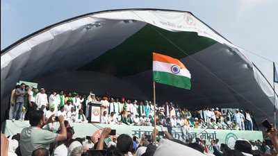 Bharatiya Kisan Union spokesperson Rakesh Tikait speaks during a 'Kisan Mahapanchayat' over the ongoing farmers' agitation against Centre's farm reform laws, in Muzaffarnagar, Sunday. (PTI)