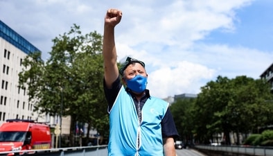 A demonstrator from the Uyghur Community gestures as he takes part in a protest (AFP) A demonstrator from the Uyghur Community gestures as he takes part in a protest (AFP)