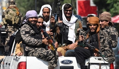 Taliban fighters patrol on vehicles (AFP/Representative Photo) Taliban fighters patrol on vehicles (AFP/Representative Photo)