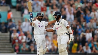 Rohit Sharma celebrates reaching his century with Cheteshwar Pujara (Action Images via Reuters)