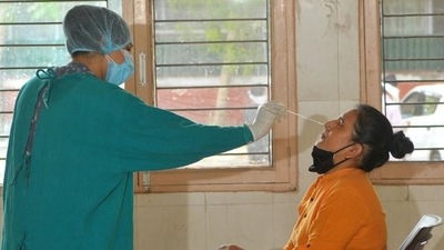 A health worker takes swab samples from a person. (HT File Photo) A health worker takes swab samples from a person. (HT File Photo)