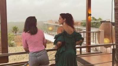 Samantha shared a picture of enjoying the rains with a friend. 