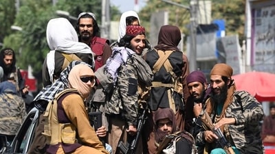 Taliban fighters patrol on vehicles along a street in Kabul. (AFP Photo) Taliban fighters patrol on vehicles along a street in Kabul. (AFP Photo)