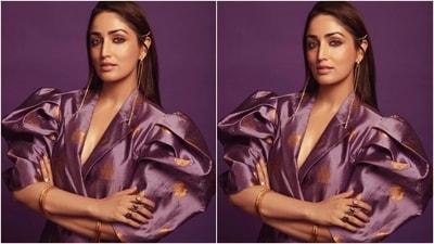 Today, Yami gave a glimpse of another look for which she wore a printed purple attire highlighted with exaggerated sleeves, gold brocade embroidery and a notch-lapel collared front. She teamed the outfit with gold jewels and open tresses. (Instagram/@yamigautam) Today, Yami gave a glimpse of another look for which she wore a printed purple attire highlighted with exaggerated sleeves, gold brocade embroidery and a notch-lapel collared front. She teamed the outfit with gold jewels and open tresses. (Instagram/@yamigautam)