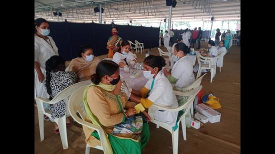 Health staff vaccinating residents at a camp in Subhash Nagar, Ludhiana, on Sunday. (HT Photo)