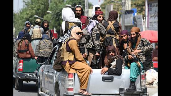 Taliban fighters patrol on vehicles along a street in Kabul on September 2, 2021. (Photo by Aamir QURESHI / AFP) (AFP)