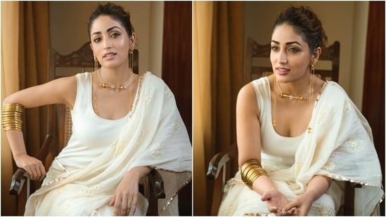 Earlier, Yami had shared pictures of herself dressed in an all-white saree dress that featured a sleeveless crewneck tank top, gold patti borders, and an embroidered pallu. She teamed the stunning look with gold stacked bangles, a vintage choker, matching earrings and a messy bun.(Instagram/@yamigautam)
