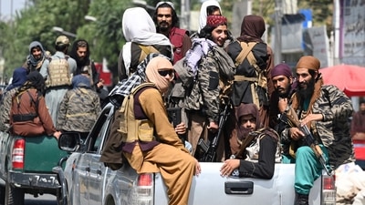 Taliban fighters patrol on vehicles along a street in Kabul on September 2, 2021. (Photo by Aamir QURESHI / AFP)&nbsp; (HT_PRINT)