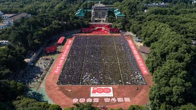 An old photo of Wuhan University graduates attenting convocation before Covid 19 led to closure of campuses and lockdown of cities. (AFP Photo/Representative use) An old photo of Wuhan University graduates attenting convocation before Covid 19 led to closure of campuses and lockdown of cities. (AFP Photo/Representative use)