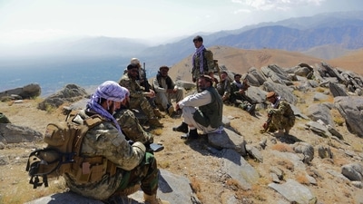 Afghan resistance movement rest as they patrol on a hilltop in Panjshir province. (AFP) Afghan resistance movement rest as they patrol on a hilltop in Panjshir province. (AFP)